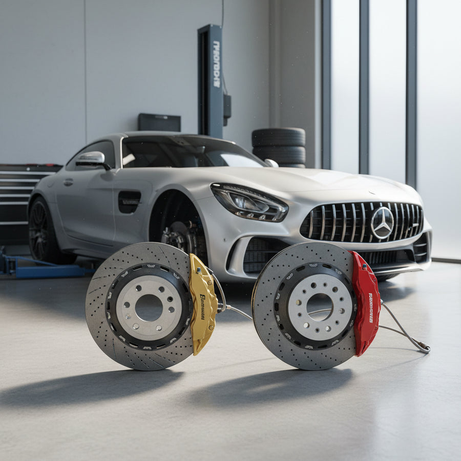 A close-up view of the gold-painted brake calipers and carbon ceramic rotors on a Mercedes-AMG GT performance coupe