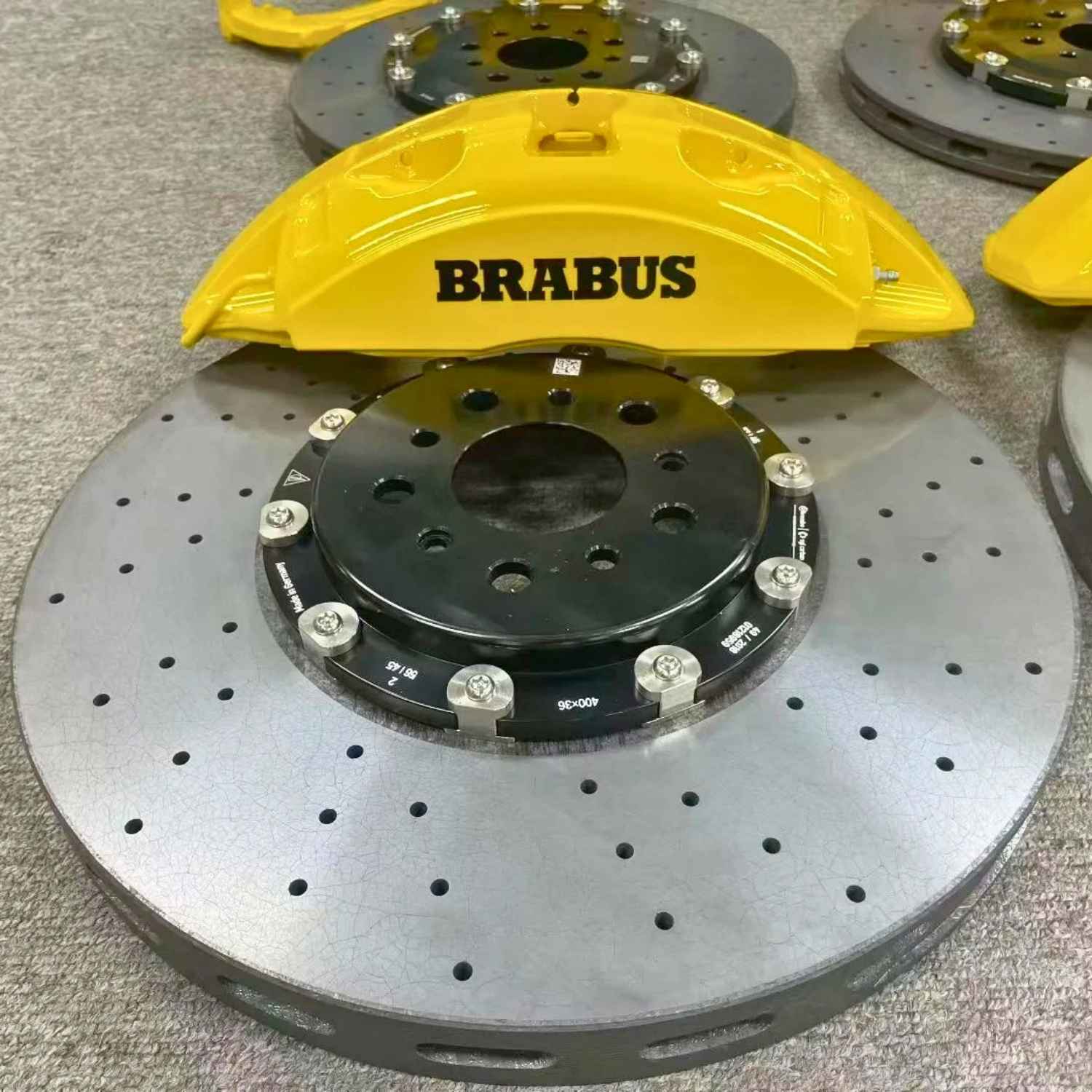 ForzaCCB 400x36mm carbon ceramic brake rotor paired with a yellow Brabus caliper for Mercedes AMG.