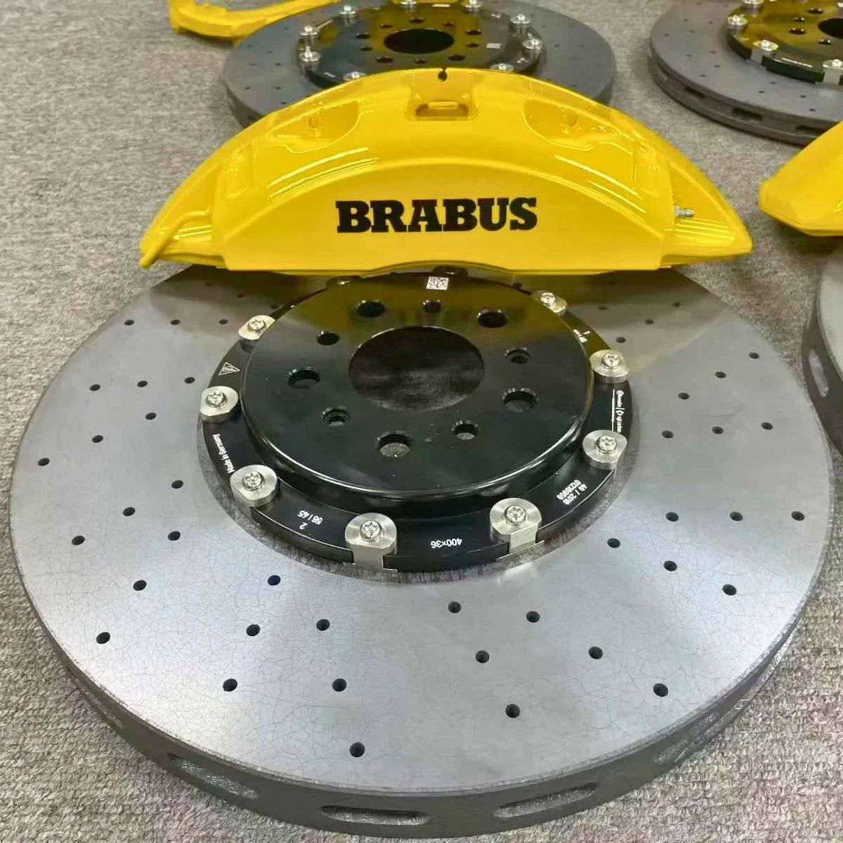 ForzaCCB 400x36mm carbon ceramic brake rotor paired with a yellow Brabus caliper for Mercedes AMG.