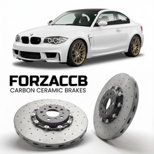ForzaCCB direct OEM replacement carbon ceramic brake rotors for 2011 to 2012 BMW 1M E82 models, shown with a white BMW 1M car.