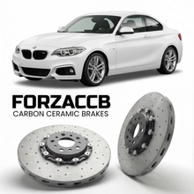 ForzaCCB direct OEM replacement carbon ceramic brake rotors for 2014 to 2021 BMW 2-Series Coupe F22 models, shown with a white BMW 2-Series Coupe car.