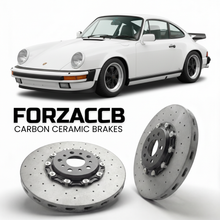 ForzaCCB direct OEM replacement carbon ceramic brake rotors for 1984 to 1989 Porsche 911 Carrera 3.2 models, shown with a white Porsche 911 Carrera 3.2 car.