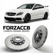ForzaCCB direct OEM replacement carbon ceramic brake rotors for 2012 to 2013 Mercedes-Benz C 63 AMG Black Series C204 models, shown with a white Mercedes-Benz C 63 AMG Black Series car.