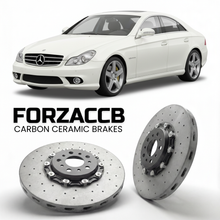 ForzaCCB direct OEM replacement carbon ceramic brake rotors for 2005 to 2006 Mercedes-Benz CLS 55 AMG C219 models, shown with a white Mercedes-Benz CLS 55 AMG car.