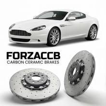 ForzaCCB direct OEM replacement carbon ceramic brake rotors for 2013 to 2016 Aston Martin DB9 VH models, shown with a white Aston Martin DB9 car.