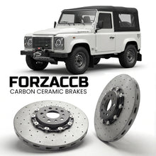 ForzaCCB direct OEM replacement carbon ceramic brake rotors for 2018 to 2019 Land Rover Defender 90 Works V8 models, shown with a white Land Rover Defender car.