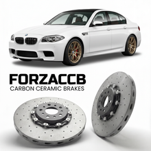 ForzaCCB direct OEM replacement carbon ceramic brake rotors for 2011 to 2016 BMW M5 Sedan F10 models, shown with a white BMW M5 Sedan car.