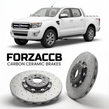 ForzaCCB direct OEM replacement carbon ceramic brake rotors for 2009-2011) Ford Ranger II Double Cab (facelift 2009 models, shown with a white Ford Ranger car.