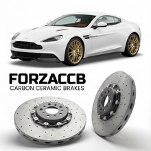 ForzaCCB direct OEM replacement carbon ceramic brake rotors for 2012 to 2018 Aston Martin Vanquish VH models, shown with a white Aston Martin Vanquish car.